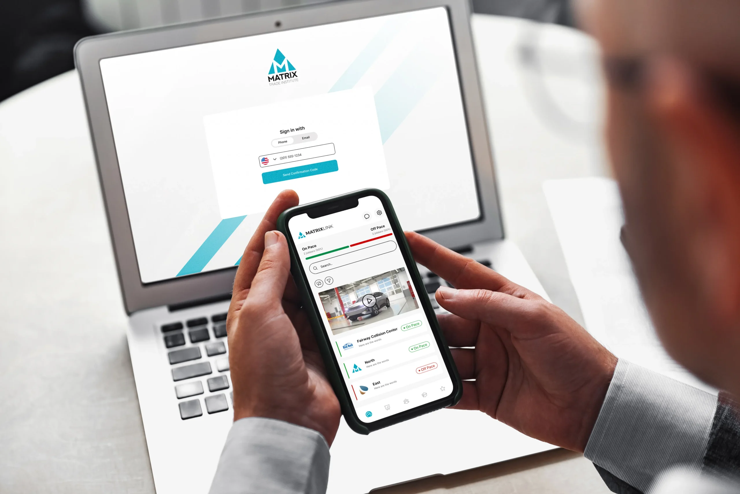 man holding mobile mobile-first LMS